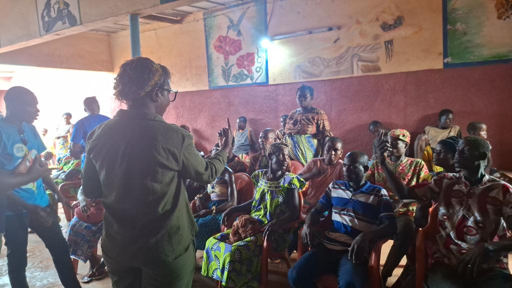 Trainer Rachel in conversation with residents of Lapo.
