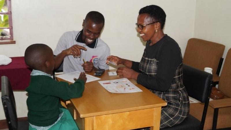 Image of people testing the Swahili version of the Speakaboo app