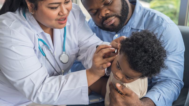 Medical officer hearing screening child