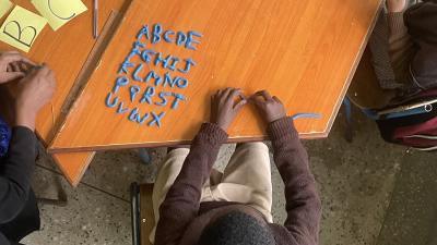 Boy learning alphabet Kenya