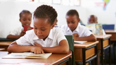 Girl reading in classroom